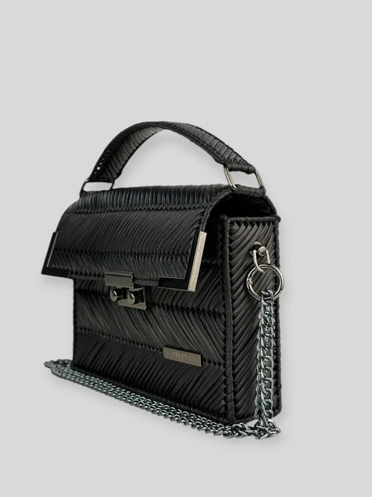 Amara Dark Brown is a luxury handmade designer bag by CATTLEYA.Y, distinguished by its rich chocolate tone and signature chevron texture. Timeless, structured and refined, it embodies quiet confidence and modern elegance.
Amara Black structured black handbag with top handle