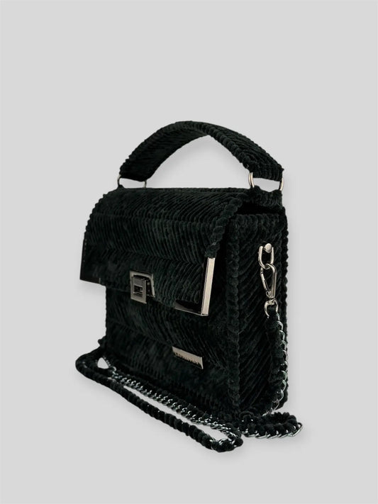 Amara Winter Black is a luxury handmade designer bag by CATTLEYA.Y, defined by its deep black tone and signature chevron texture. A timeless piece that embodies confident minimalism and refined sophistication.
Amara Winter Black structured black handbag with top handle