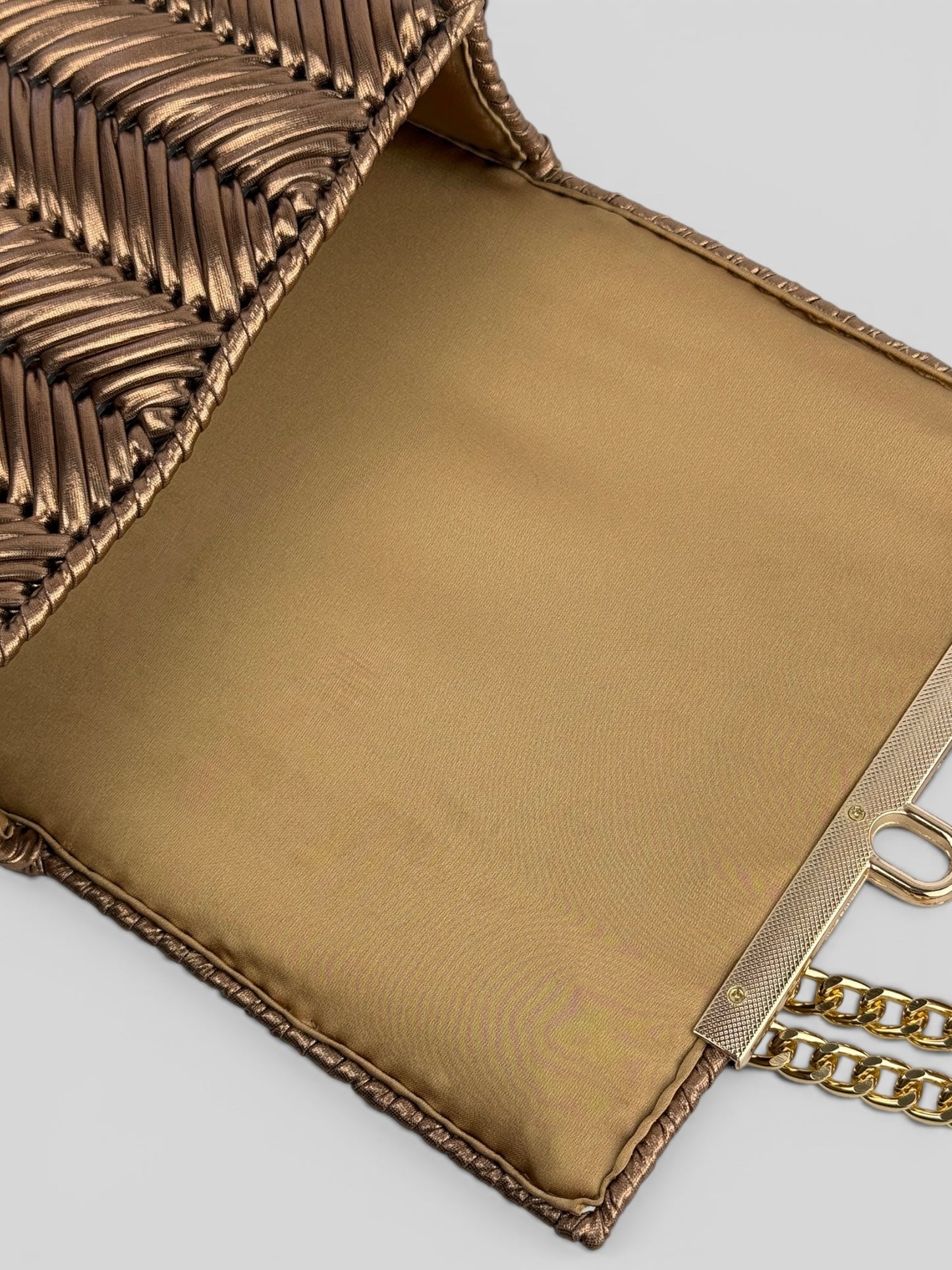 Brilliant Bronze is a luxury handmade mini designer bag by CATTLEYA.Y.
Golden satin lining inside Brilliant Bronze designer mini bag.