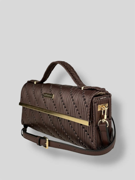 Cocoa is a luxury handmade designer bag by CATTLEYA.Y, designed for women who appreciate understated elegance. The rich brown tone and geometric woven texture create a refined yet contemporary silhouette.Cocoa brown geometric textured handbag side angle