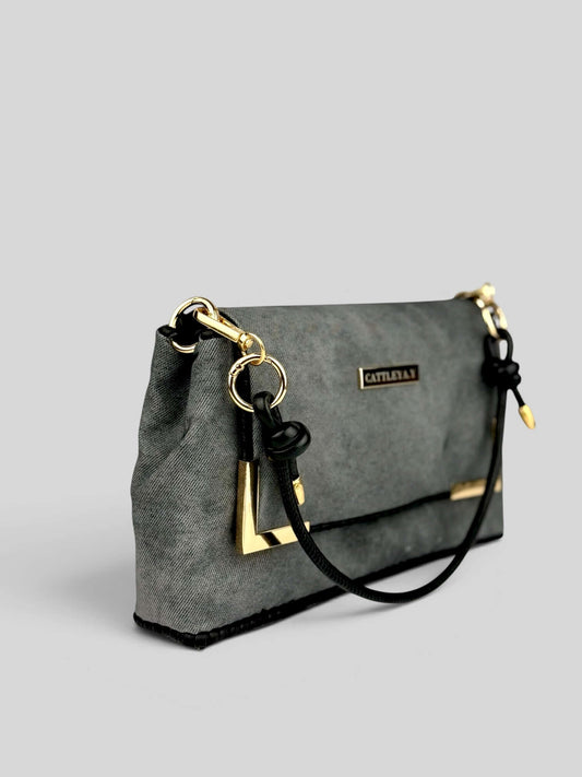 Denim Graphite bag side view with strap.
Denim Graphite is a Luxury Handmade Designer Bag by CATTLEYA.Y