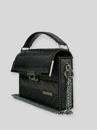 Amara Dark Brown is a luxury handmade designer bag by CATTLEYA.Y, distinguished by its rich chocolate tone and signature chevron texture. Timeless, structured and refined, it embodies quiet confidence and modern elegance.
Amara Black structured black handbag with top handle