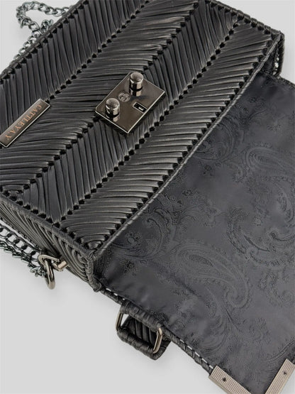 Amara Dark Brown is a luxury handmade designer bag by CATTLEYA.Y, distinguished by its rich chocolate tone and signature chevron texture. Timeless, structured and refined, it embodies quiet confidence and modern elegance.
Paisley lining inside Amara Black designer handbag