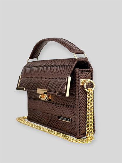 Amara Dark Brown is a luxury handmade designer bag by CATTLEYA.Y, distinguished by its rich chocolate tone and signature chevron texture. Timeless, structured and refined, it embodies quiet confidence and modern elegance.