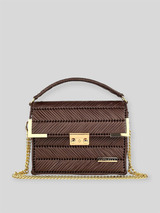 Amara Dark Brown is a luxury handmade designer bag by CATTLEYA.Y, distinguished by its rich chocolate tone and signature chevron texture. Timeless, structured and refined, it embodies quiet confidence and modern elegance.