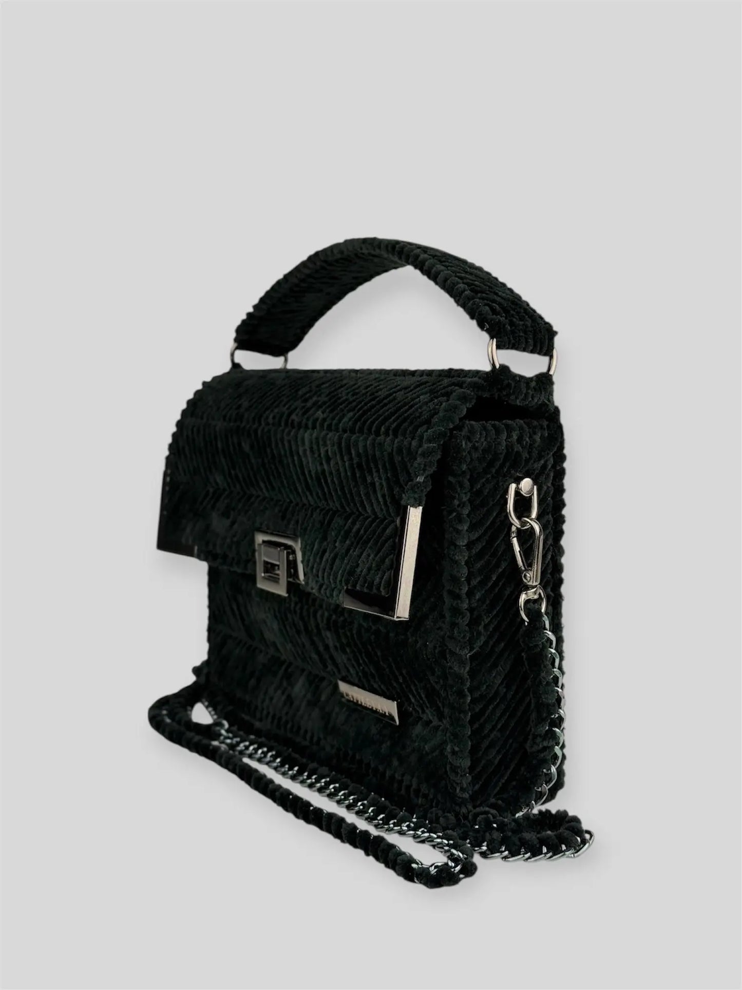 Amara Winter Black is a luxury handmade designer bag by CATTLEYA.Y, defined by its deep black tone and signature chevron texture. A timeless piece that embodies confident minimalism and refined sophistication.
Amara Winter Black structured black handbag with top handle