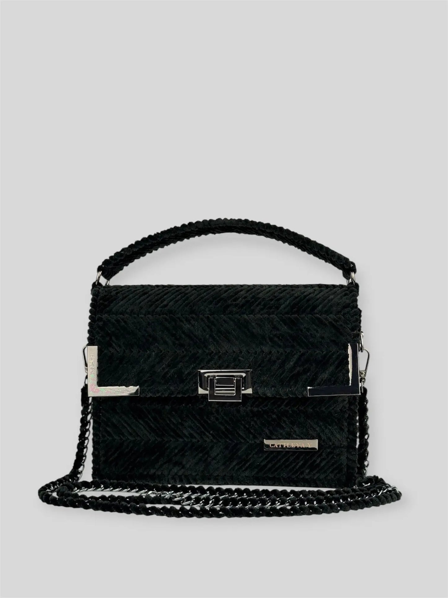 Amara Winter Black is a luxury handmade designer bag by CATTLEYA.Y, defined by its deep black tone and signature chevron texture. A timeless piece that embodies confident minimalism and refined sophistication.
Amara Winter Black luxury chevron designer handbag CATTLEYA.Y