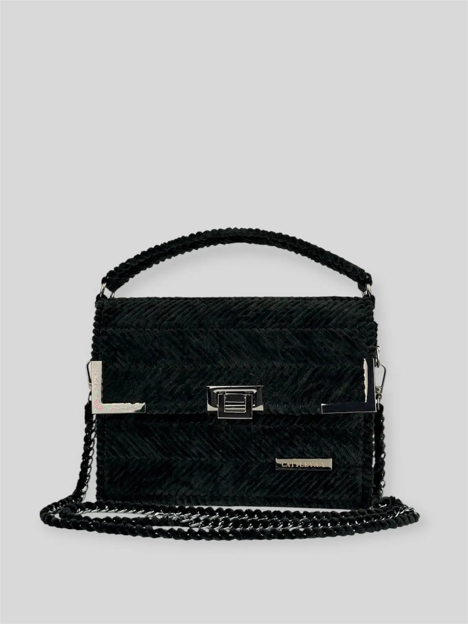 Amara Winter Black is a luxury handmade designer bag by CATTLEYA.Y, defined by its deep black tone and signature chevron texture. A timeless piece that embodies confident minimalism and refined sophistication.
Amara Winter Black luxury chevron designer handbag CATTLEYA.Y