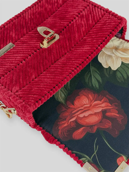 Amara Winter Blue is a luxury handmade designer bag by CATTLEYA.Y, defined by its deep blue tone and refined chevron texture. The structured silhouette creates a polished presence suitable for both elevated everyday wear and evening styling.
Floral patterned lining inside Amara Winter Red handbag