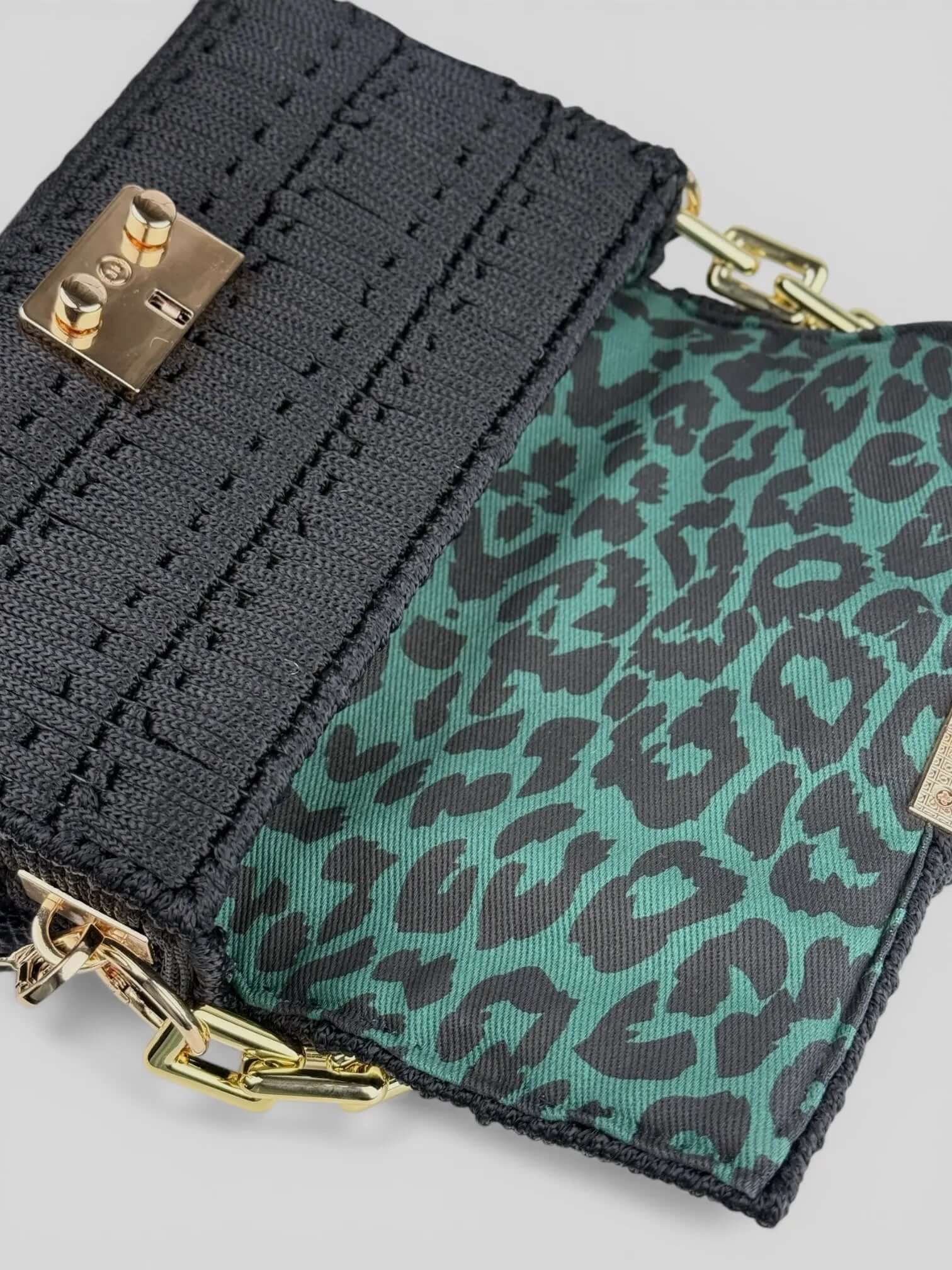 Aurora Black is a luxury handmade macrame designer bag by CATTLEYA.Y. The interior is with animal print lining.