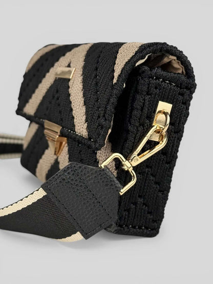 Aurora is a luxury handmade macrame designer bag. It has gold hardware and geometric chevron design