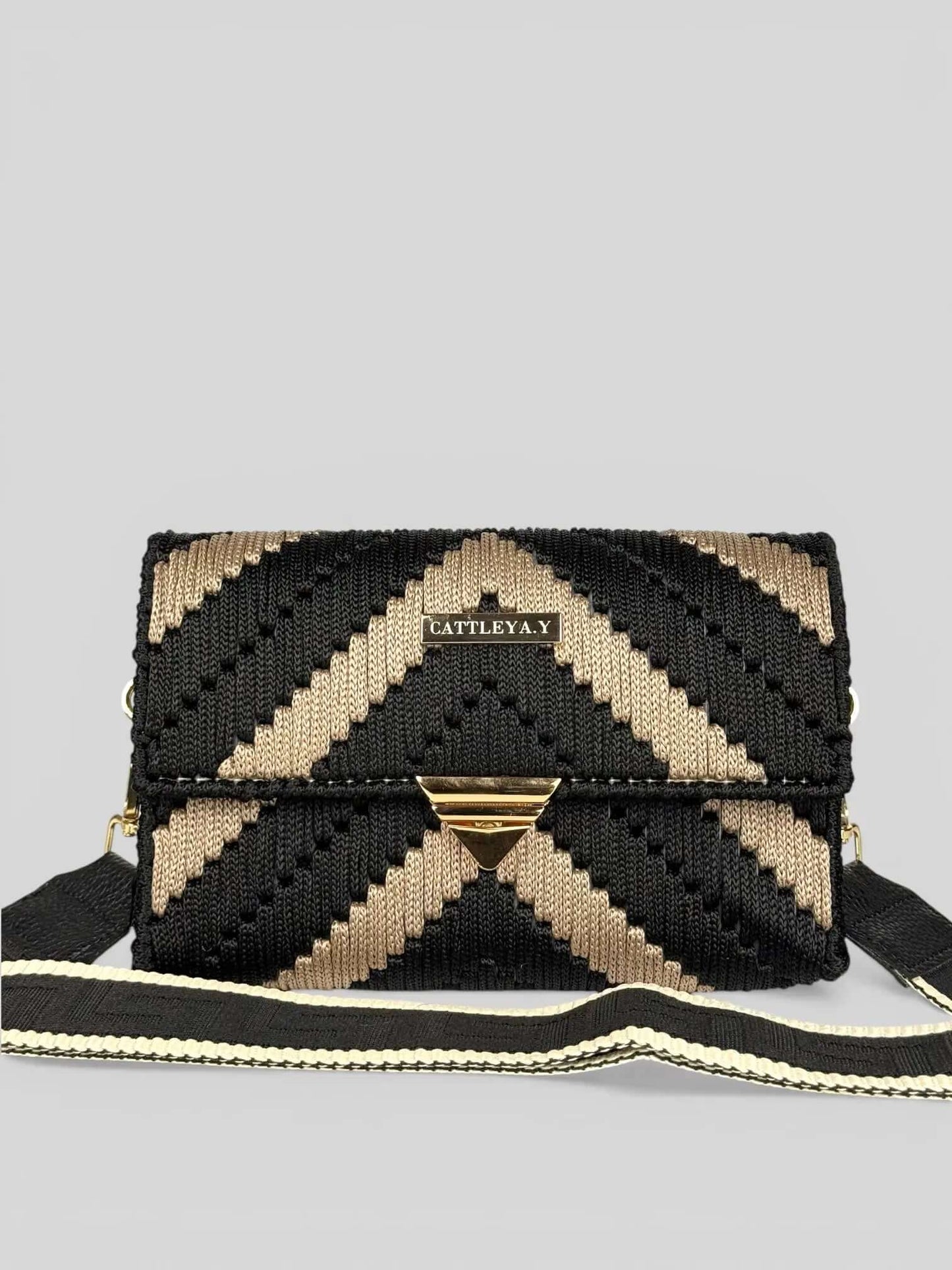 Aurora is a luxury handmade macrame designer bag. It is with black and sand chevron pattern by CATTLEYA.Y