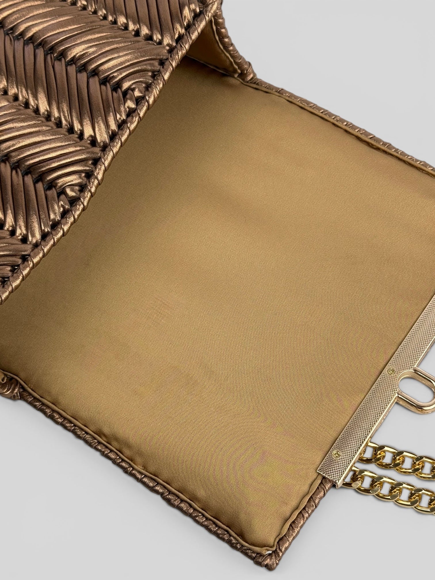 Brilliant Bronze is a luxury handmade mini designer bag by CATTLEYA.Y.
Golden satin lining inside Brilliant Bronze designer mini bag.