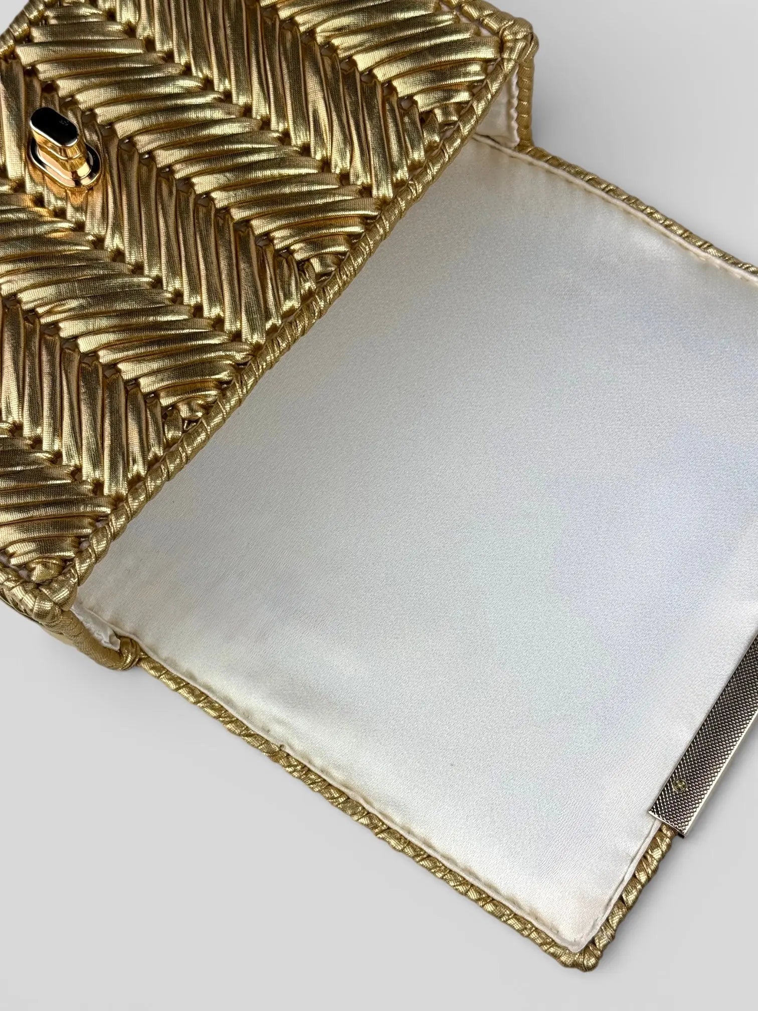 Brilliant Gold is a luxury handmade mini designer bag by CATTLEYA.Y.
Golden satin lining inside Brilliant Gold designer mini bag.