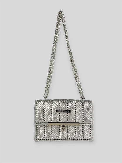 Brilliant Silver is a luxury handmade mini designer bag by CATTLEYA.Y, defined by its luminous metallic finish and refined chevron texture. The cool silver tone reflects light effortlessly, creating a striking yet sophisticated presence.