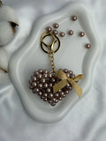 Champagne Pearl Heart is a luxury bag charm by CATTLEYA.Y