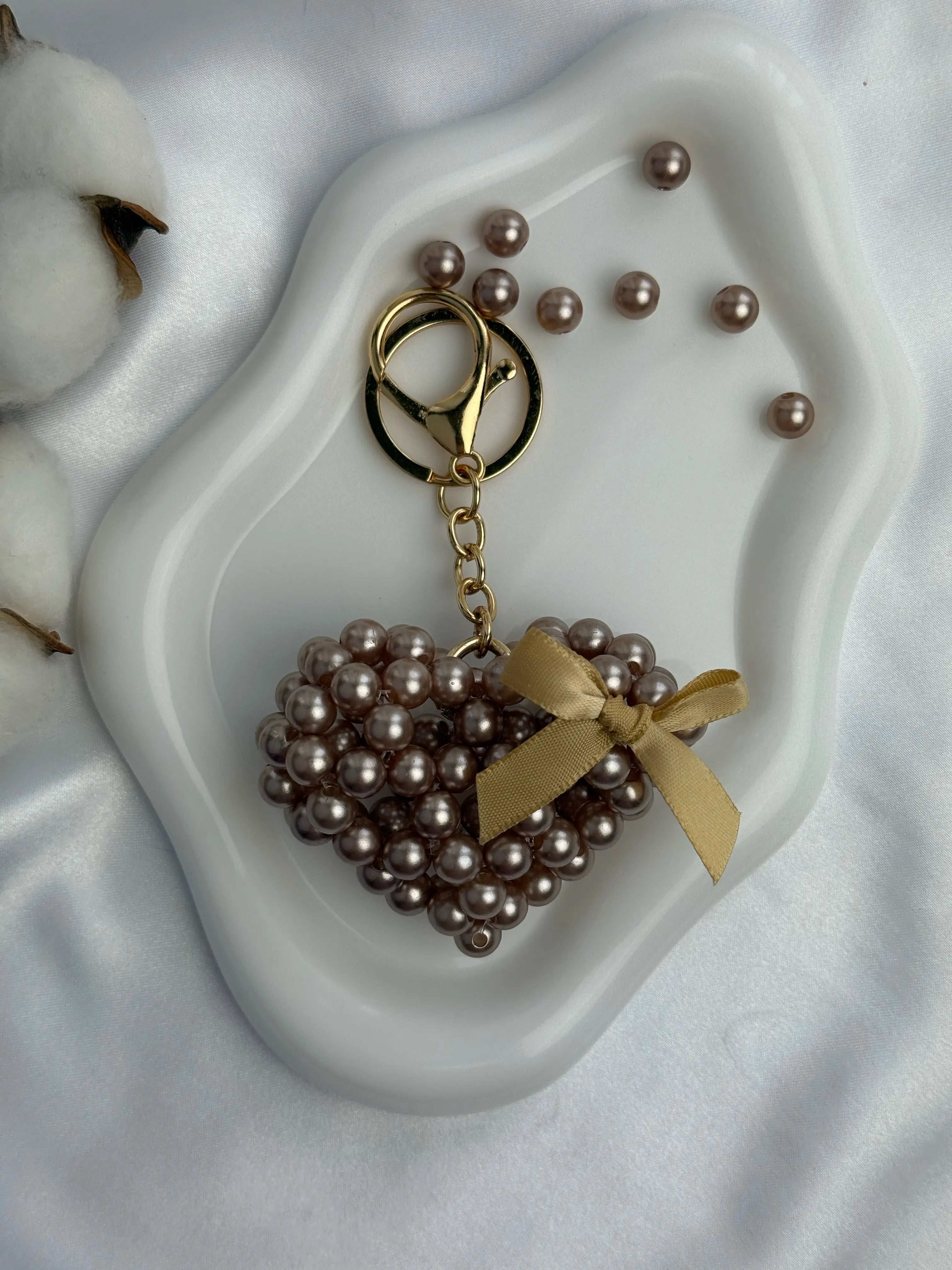 Champagne Pearl Heart is a luxury bag charm by CATTLEYA.Y
