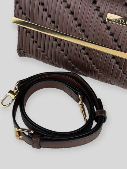 Cocoa is a luxury handmade structured designer bag by CATTLEYA.Y, designed for women who appreciate understated elegance. The rich brown tone and geometric woven texture create a refined yet contemporary silhouette.
Gold-tone hardware detail on Cocoa designer bag
Adjustable strap detail Cocoa brown luxury bag