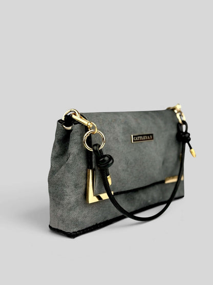 Denim Graphite bag side view with strap.
Denim Graphite is a Luxury Handmade Designer Bag by CATTLEYA.Y