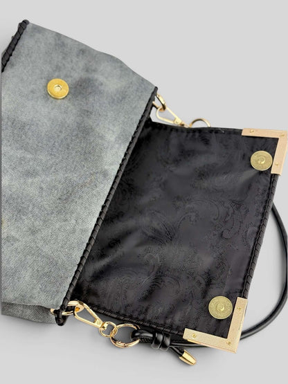 Interior of Denim Graphite handbag with black lining and magnetic closure.
Denis Graphite is luxury handmade designer bag by CATTLEYA.Y