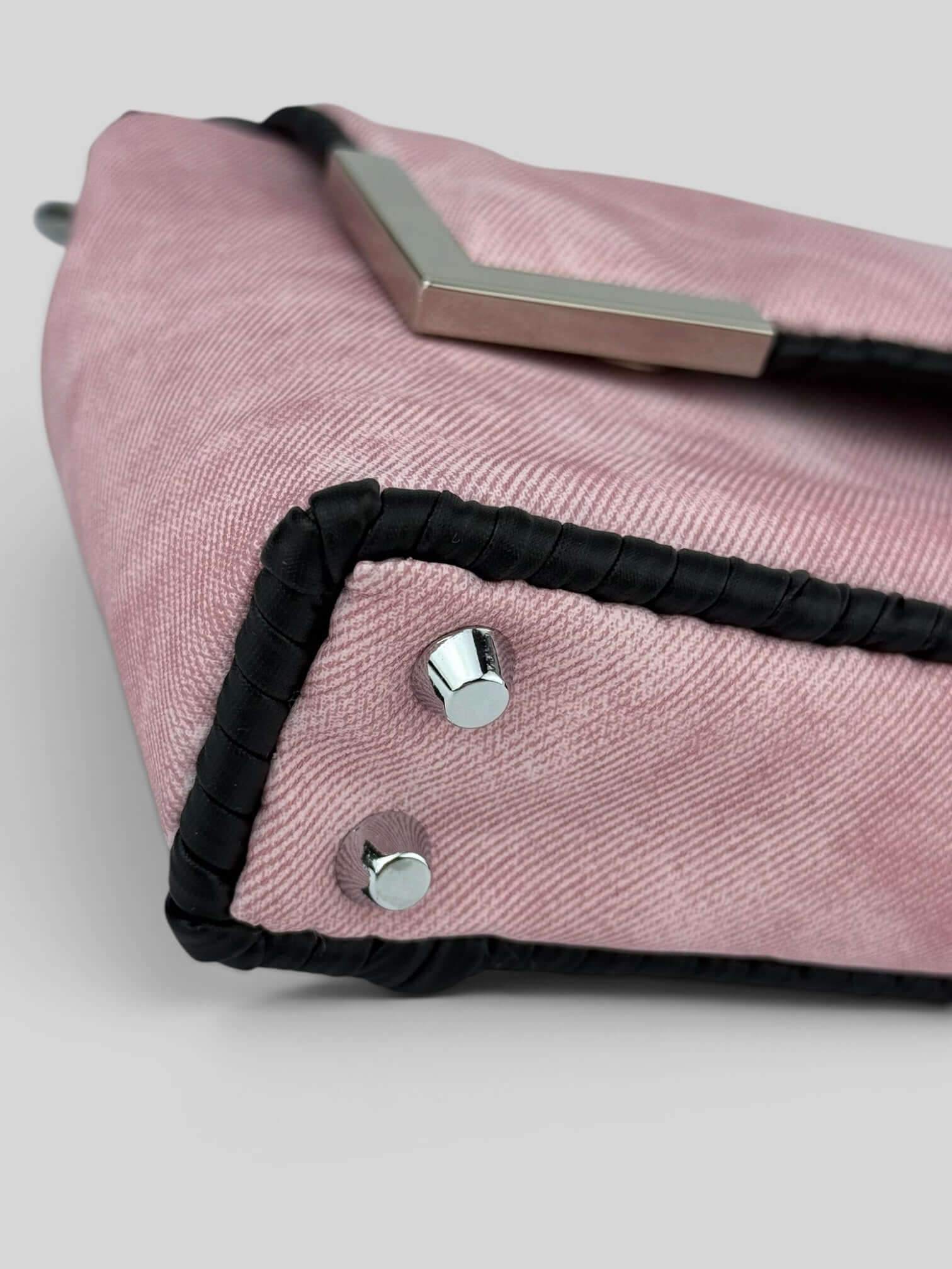 Denim Pink denim bag texture detail in soft pink. Denim Pink is a Luxury Handmade Designer Bag by CATTLEYA.Y