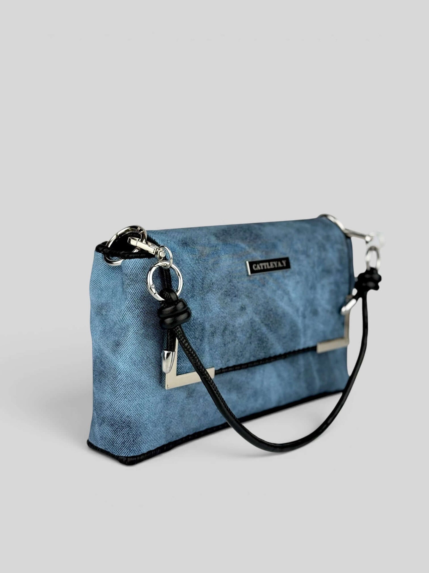Denim Sky bag side view with strap.
Denim Sky is a Luxury Handmade Designer Bag by CATTLEYA.Y