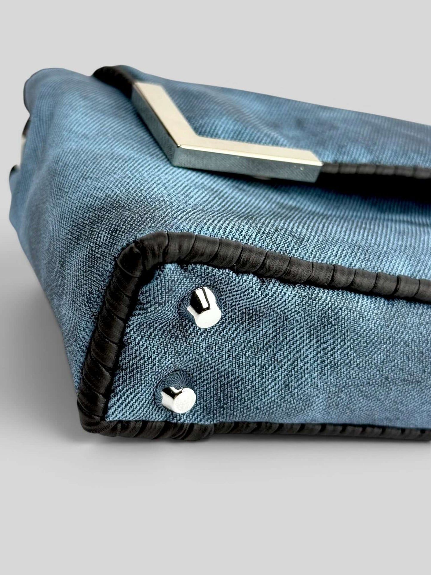 Denim Pink denim bag texture detail in soft pink. Denim Pink is a Luxury Handmade Designer Bag by CATTLEYA.Y