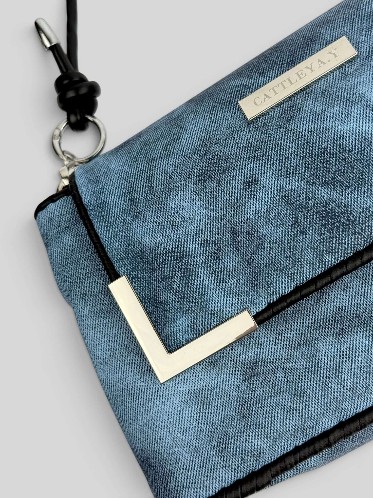 Denim Sky denim bag texture detail in blue. Denim Sky is a Luxury Handmade Designer Bag by CATTLEYA.Y