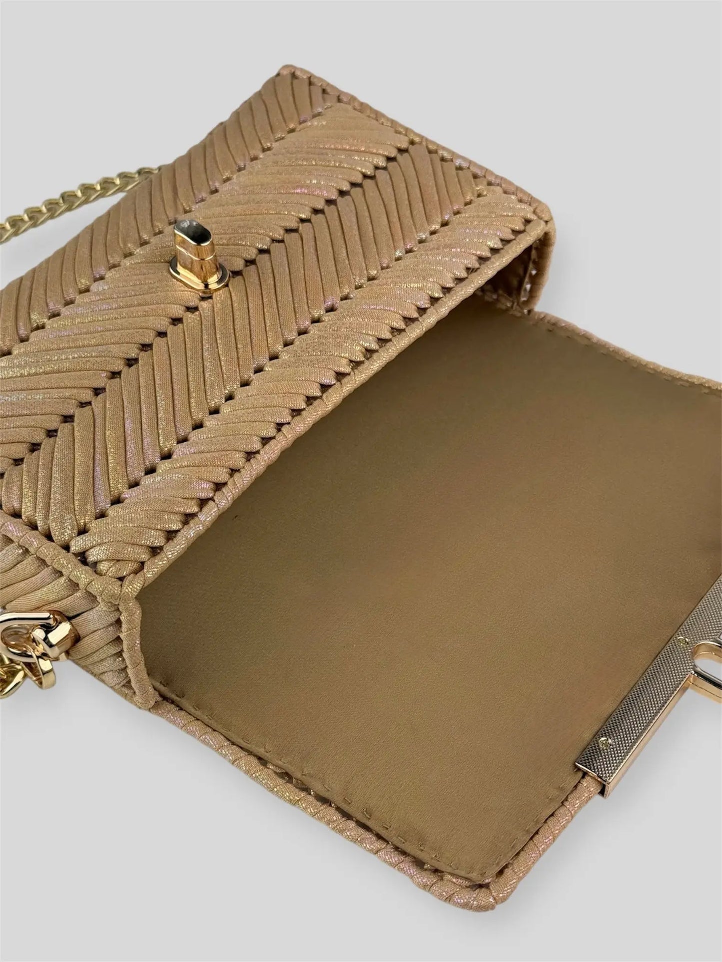 Mermaid Coral is a luxury handmade designer bag by CATTLEYA.Y, defined by its luminous pearlescent yarn and sculpted geometric texture. Inspired by warm ocean tones, it radiates soft elegance and refined femininity.
Golden satin lining inside Mermaid Coral designer bag