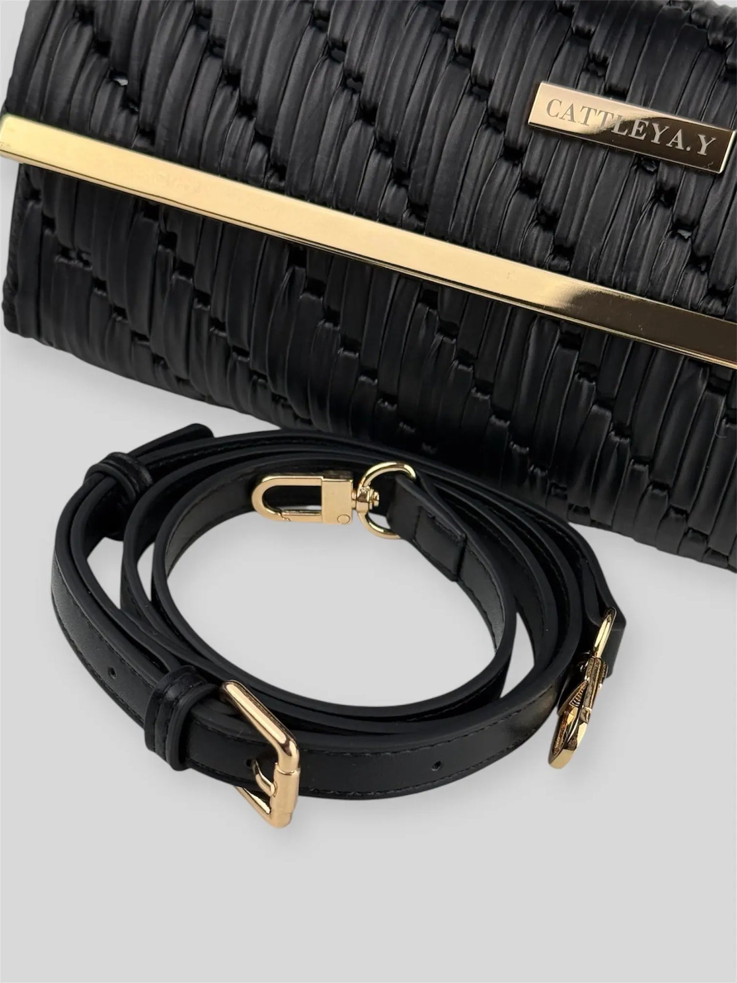 Noir is a luxury handmade designer bag by CATTLEYA.Y, defined by its deep black tone and architectural silhouette. Designed for women who embrace modern minimalism, it delivers powerful elegance with refined restraint.
Adjustable strap detail Noir black designer bag