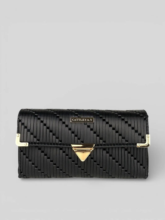 Tiffany is a black luxury handmade designer bag by CATTLEYA.Y. A front view with gold hardware.